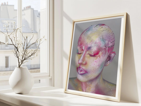 Ascendance fine art print by Lowri Francesca displayed in a frame on a bright windowsill, showing a colour abstract expressionist portrait